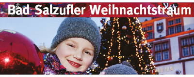 Bild von lächelndem Kind draußen vor einem Weihnachtsbaum und Text "Bad Salzufler Weihnachtstraum"