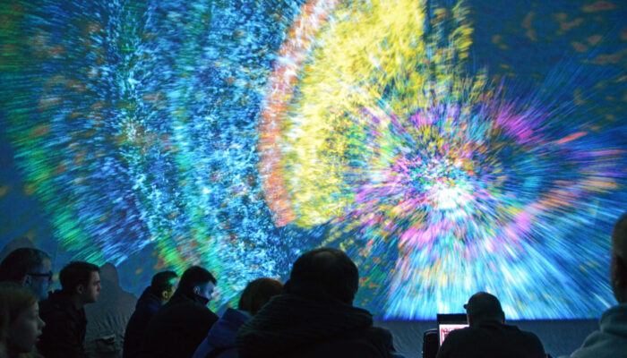 Light show from Deep Space Live in Ars Electronica, Linz, Austria. Under the motto Cosmic Origin, professionals convey their astronomical knowledge to children and the general public to inform them of what humanity currently know about the Universe.